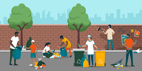 Young people volunteering and cleaning up the city street, they are collecting waste, removing dirt from a wall and separating garbage into different trash bins, environmental care concept