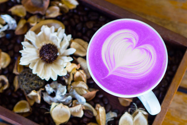 istock taro latte art top view on wood table 1193475867