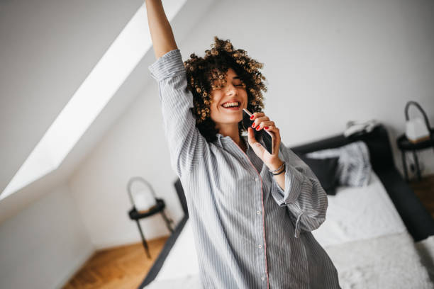 istock Happy young woman at home 1193483059