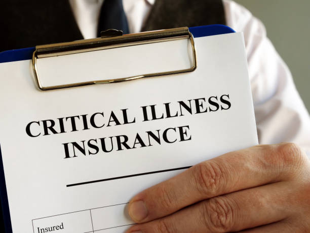 istock Critical illness insurance application form in the hands. 1193484034