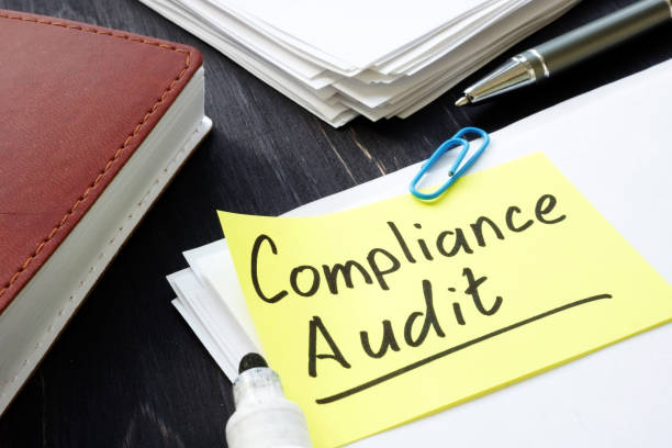 istock Compliance audit concept. Stack of papers in the office. 1193484188