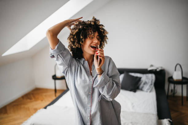 Happy young woman at home