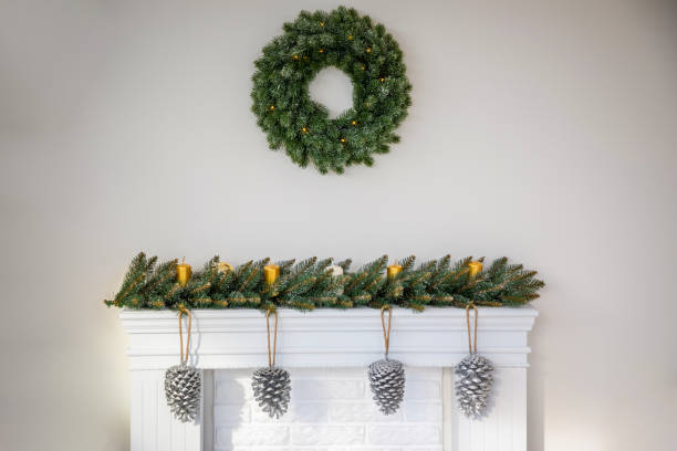 istock Fireplace with beautiful Christmas wreath, decorations in room 1193484318