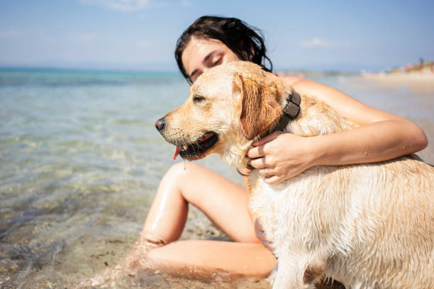istock Young woman having fun with her dog 1193484487