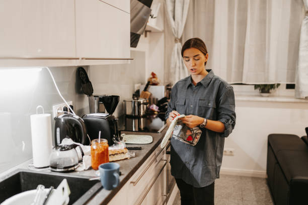 istock Young woman in kitchen 1193484493