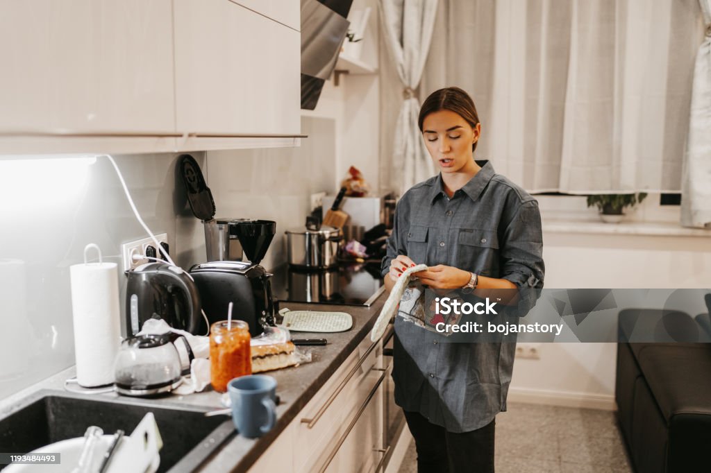Young woman in kitchen 20-29 Years Stock Photo