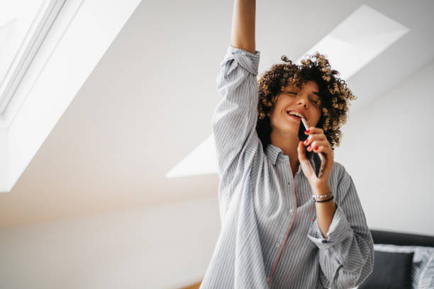 Happy young woman at home