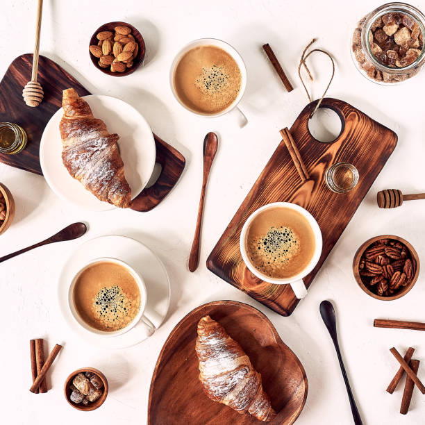 istock breakfast pattern, croissant, coffee, honey, cinnamon sticks, nuts, sugar. Good morning concept. 1193484639
