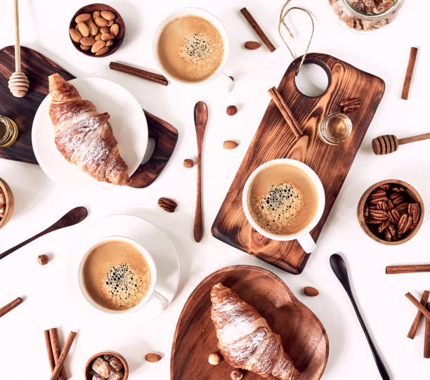 istock breakfast pattern, croissant, coffee, honey, cinnamon sticks, nuts, sugar. Good morning concept. 1193484643