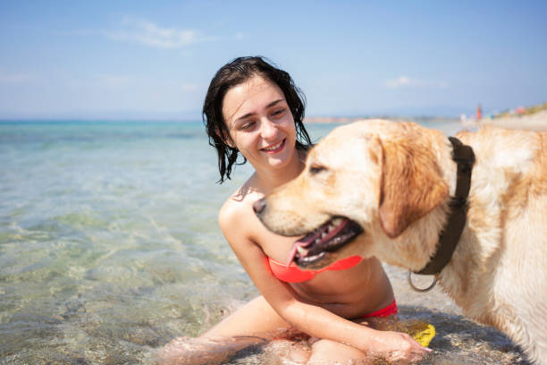 istock Young woman having fun with her dog 1193484653