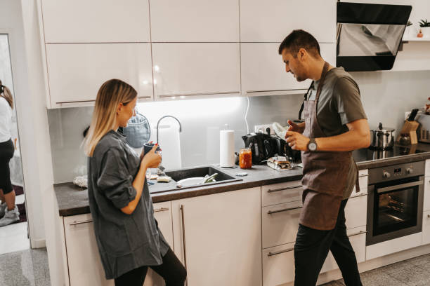 istock Happy young couple in kitchen 1193485261