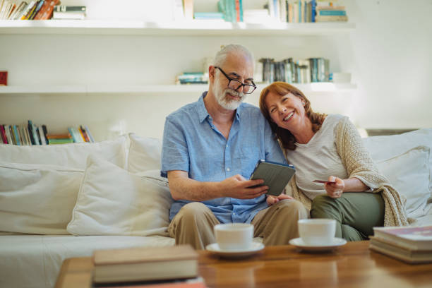 istock Modern senior couple shopping online 1193485381