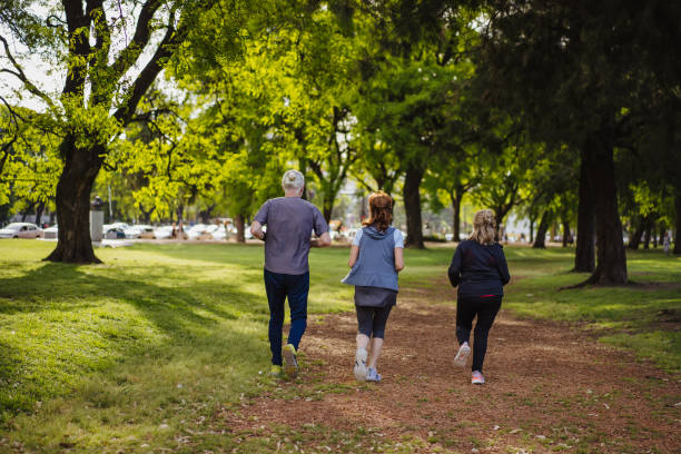 istock Seniors jogging in park 1193485453