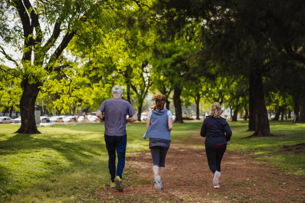 istock Seniors jogging in park 1193485598