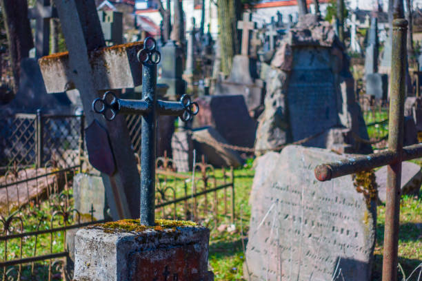 istock graves and crosses in old cemetery 1193486873