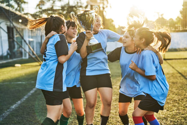 футбольная женская сборная празднует успех - child celebration cheering victory стоковые фото и изображения