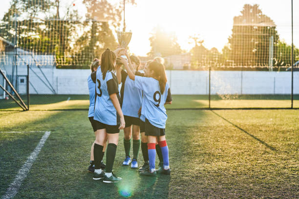 istock Soccer team with trophy celebrating success 1193487525