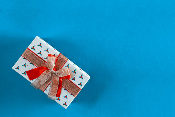 istock Christmas gift box on blue background with copy space. Flat lay. 1193488486