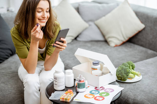 istock Woman taking vitamins or nutritional supplements 1193488910
