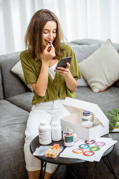 istock Woman taking vitamins or nutritional supplements 1193488915