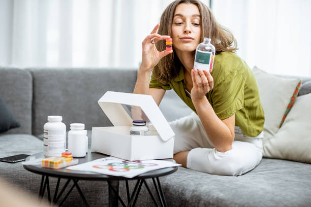istock Woman taking vitamins or nutritional supplements 1193488933