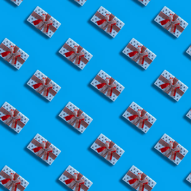 istock Seamless Christmas pattern with Xmas gift box on blue background. 1193488971