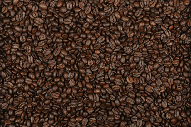 istock Scattering of coffee beans, close up. 1193489552