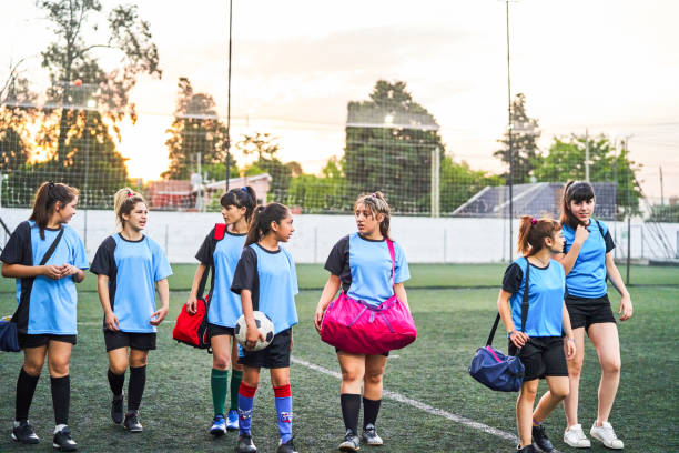 istock Girls talking while walking after soccer practice 1193489662