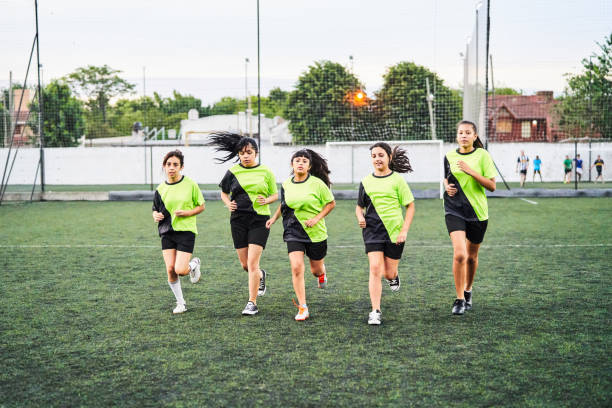 istock Soccer girls warming up before match on field 1193489664