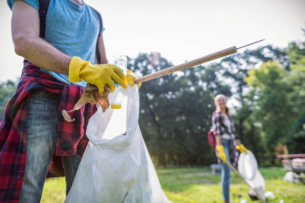 istock Collecting litter from the local park 1193489696