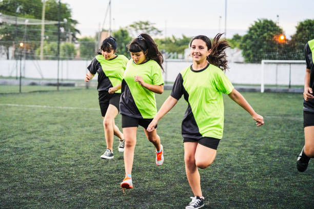 istock Female soccer players running before match 1193489735