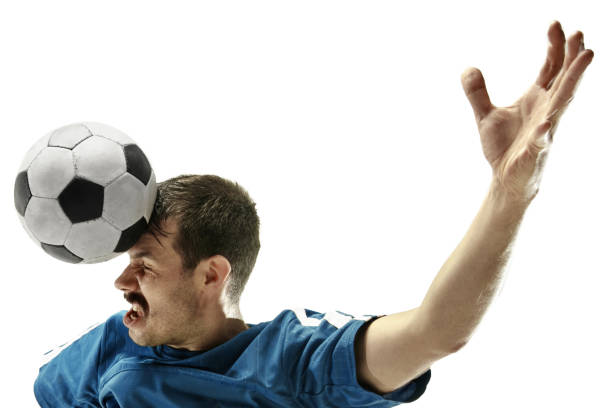 孤立した白い背景に頭でボールを打つサッカーをしている感情的な男のクローズアップ - soccer player men flying kicking ストックフォトと画像