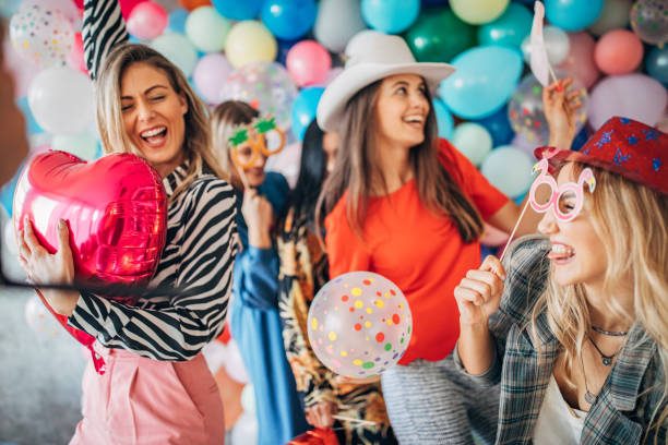 istock Women having fun with balloons 1193491102