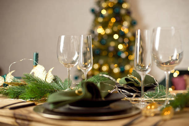 istock Table served for Christmas dinner in living room, close-up view, table setting, Christmas decoration. 1193492652