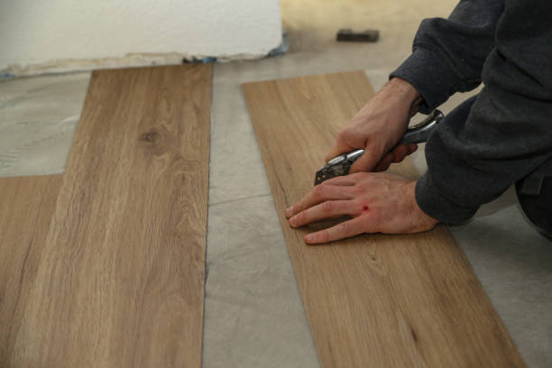istock The worker installing new vinyl tile floor 1193493114