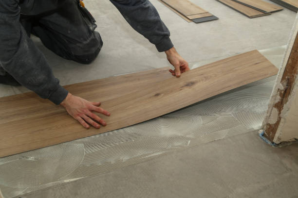 istock The worker installing new vinyl tile floor 1193493143