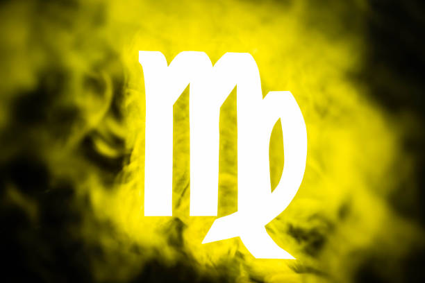 yellow illuminated Virgo zodiac sign with smoke on background