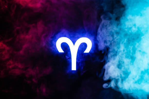 Top view golden zodiac sign Aries on blue velvet background