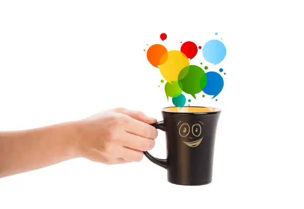 Coffee-mug with colorful abstract speech bubble, isolated on white