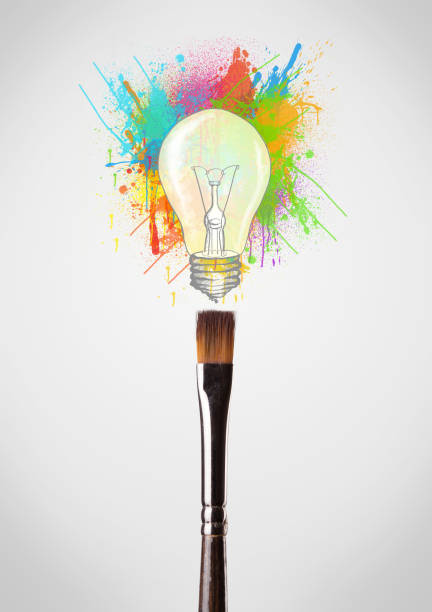 istock Brush close-up with colored paint splashes and lightbulb 1193495536