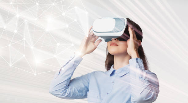 istock Young woman in VR glasses looking at 3d interactive model 1193495799
