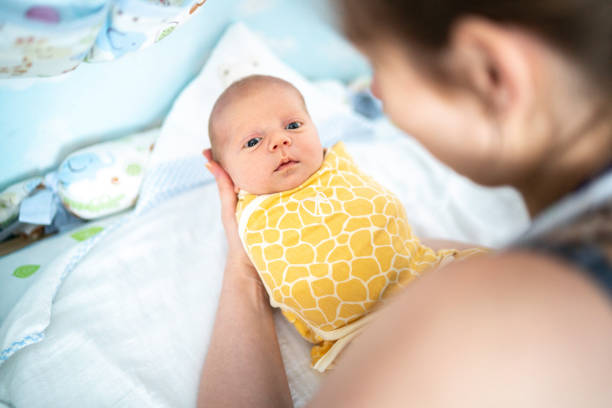 istock Emotional mom holding her newborn 1193495907