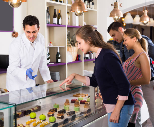 istock Old friends are choosing cakes from showcase 1193495954