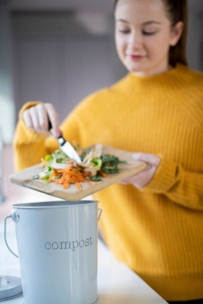 istock Woman Making Compost From Vegetable Leftovers In Kitchen 1193496776