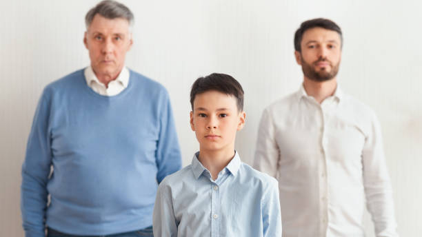 istock Serious Boy, Father And Grandfather Standing Over White Background, Panorama 1193496840