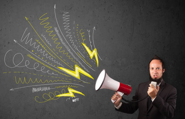 istock Leader guy shouting into megaphone with hand drawn lines and arrows 1193496878