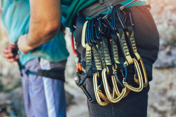 istock Senior climber with climbing equipment, preparing for climbing. 1193502924