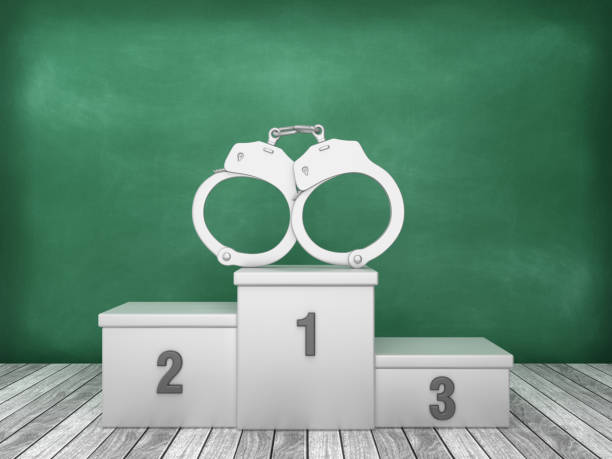 istock Podium with Handcuffs on Chalkboard Background - 3D Rendering 1193505081