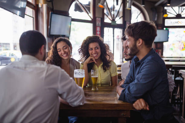 istock Friends gathering in pub, watching a soccer game 1193505109
