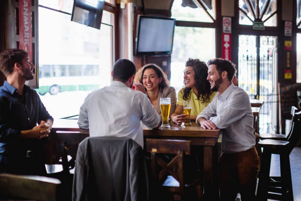 istock Friends gathering in pub, watching a soccer game 1193505122